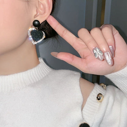 Boucles d'oreilles pendantes en forme de cœur noir en or