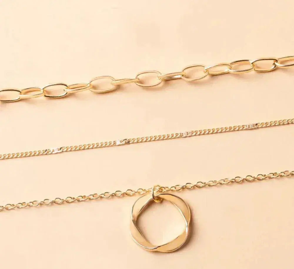 Collier vintage en chaîne dorée superposée et pendentif